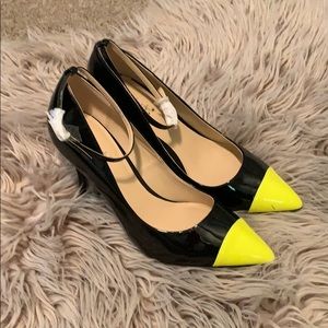 Black and yellow high heels